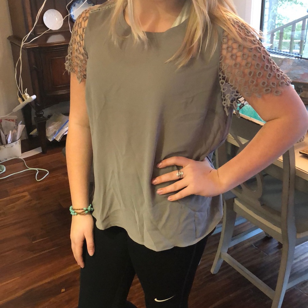 Grey shirt with circle sleeve detailing
